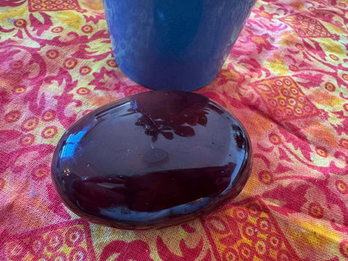 A carved and polished carnelian palmstone, dimensions 70mm x 50mm, approx weight 110g.